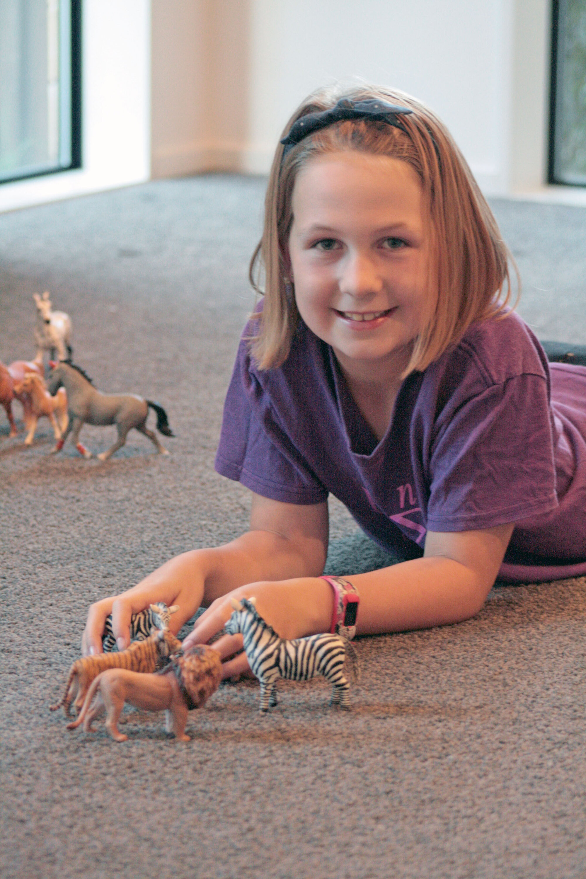 Maggie playing with her collection of Schleich animals