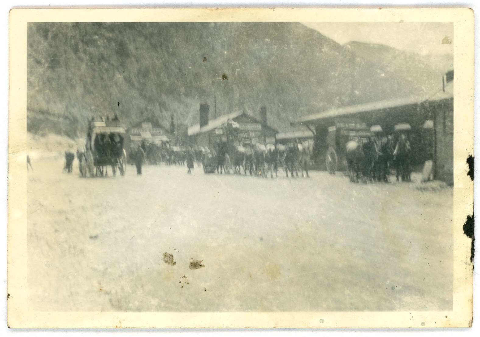 Stagecoaches at the station in the snow 
