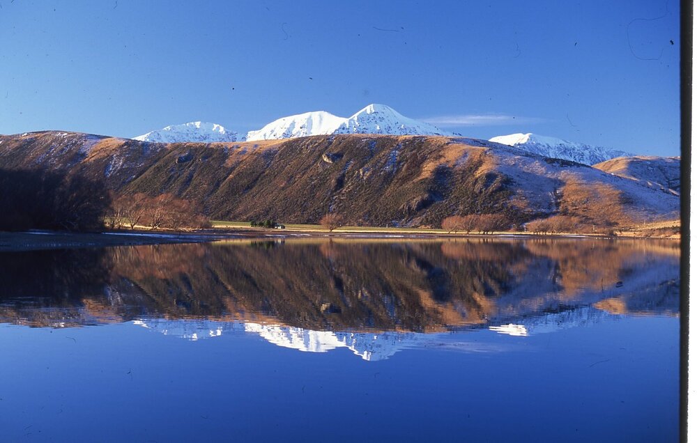 Reflections in Moana Rua Lake Pearson