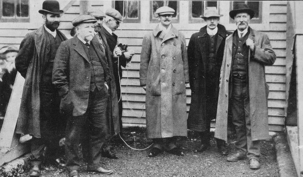 Official group at the flag raising ceremony