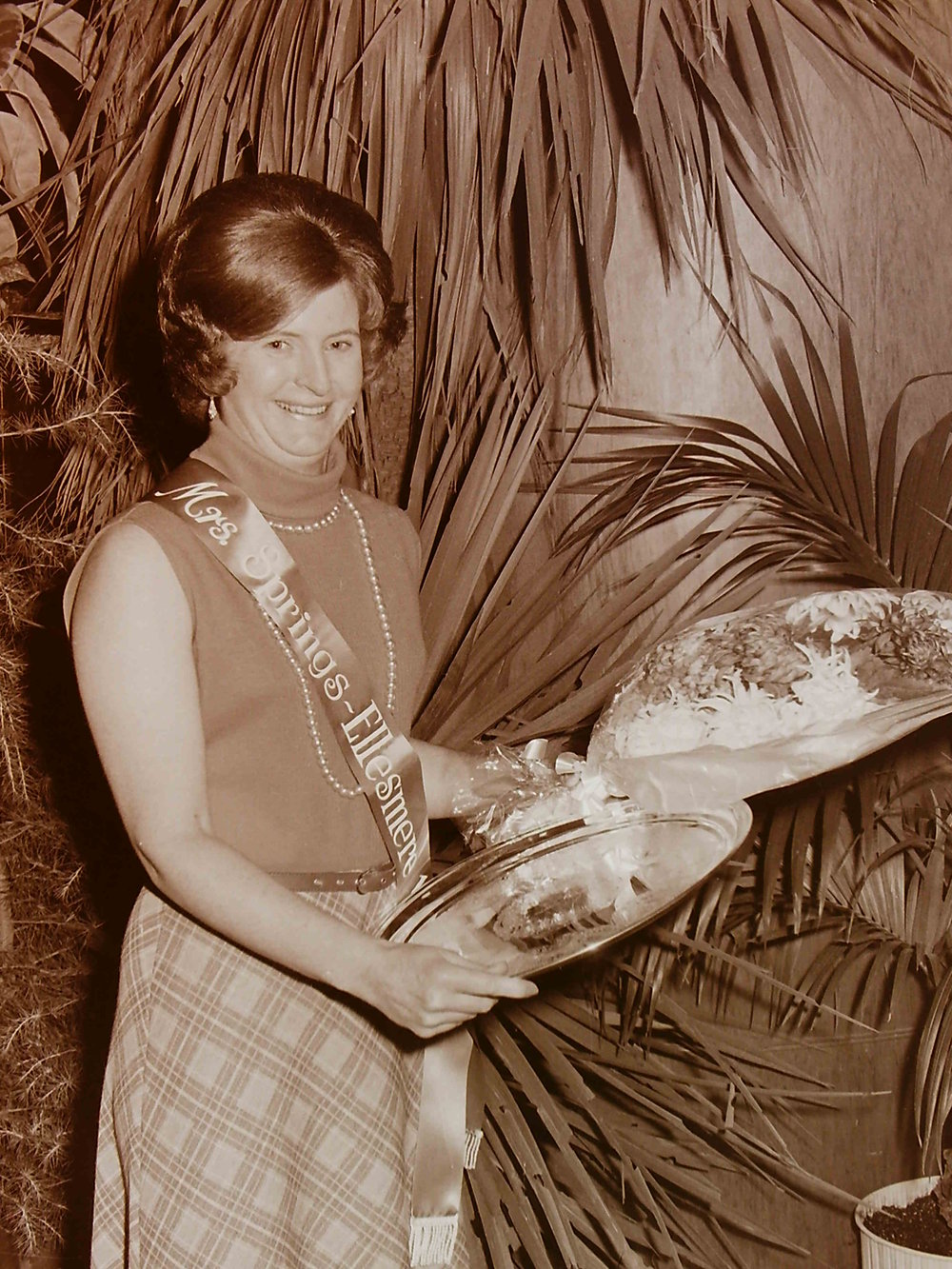 Mrs Springs-Ellesmere 1974 holding flowers