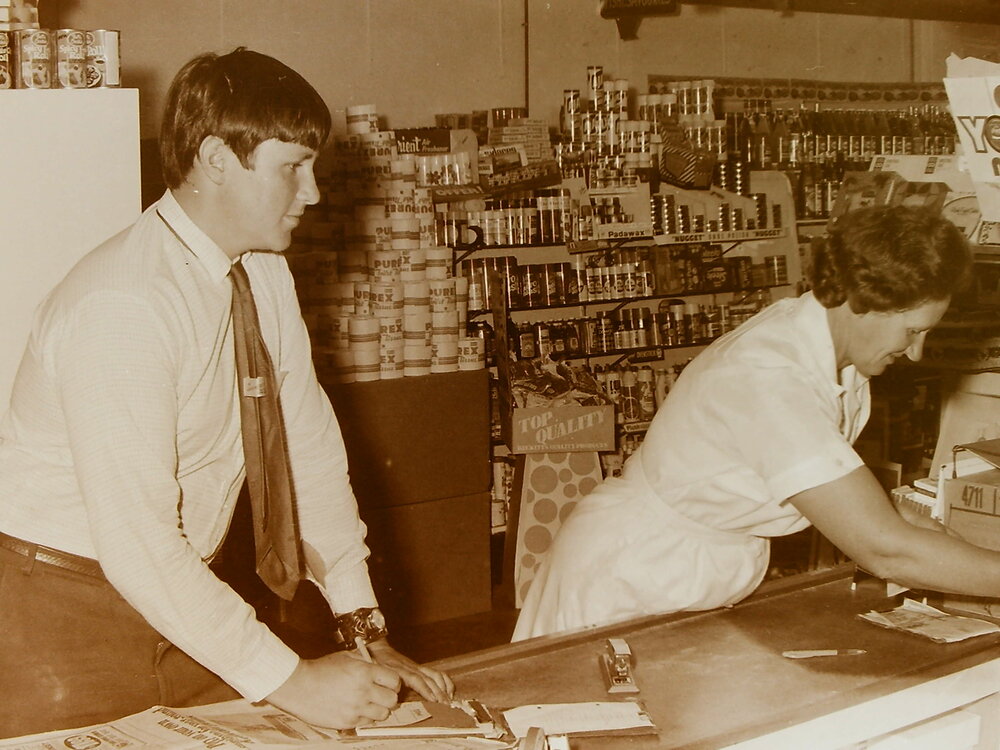 Shop assistants at counter