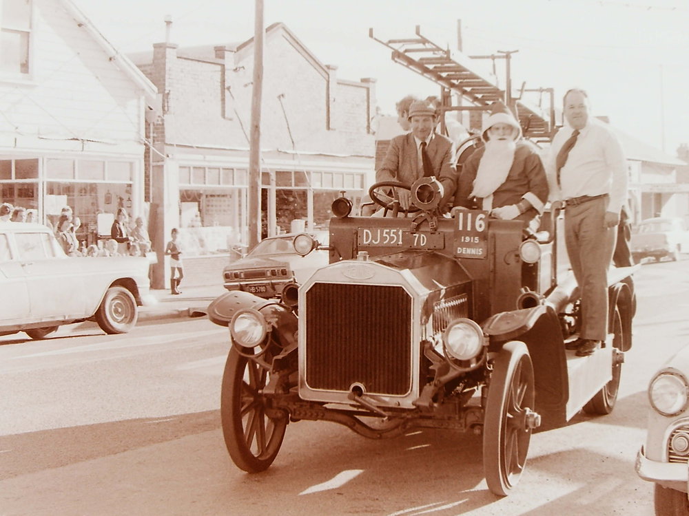 Santa arrives in fire truck sleigh
