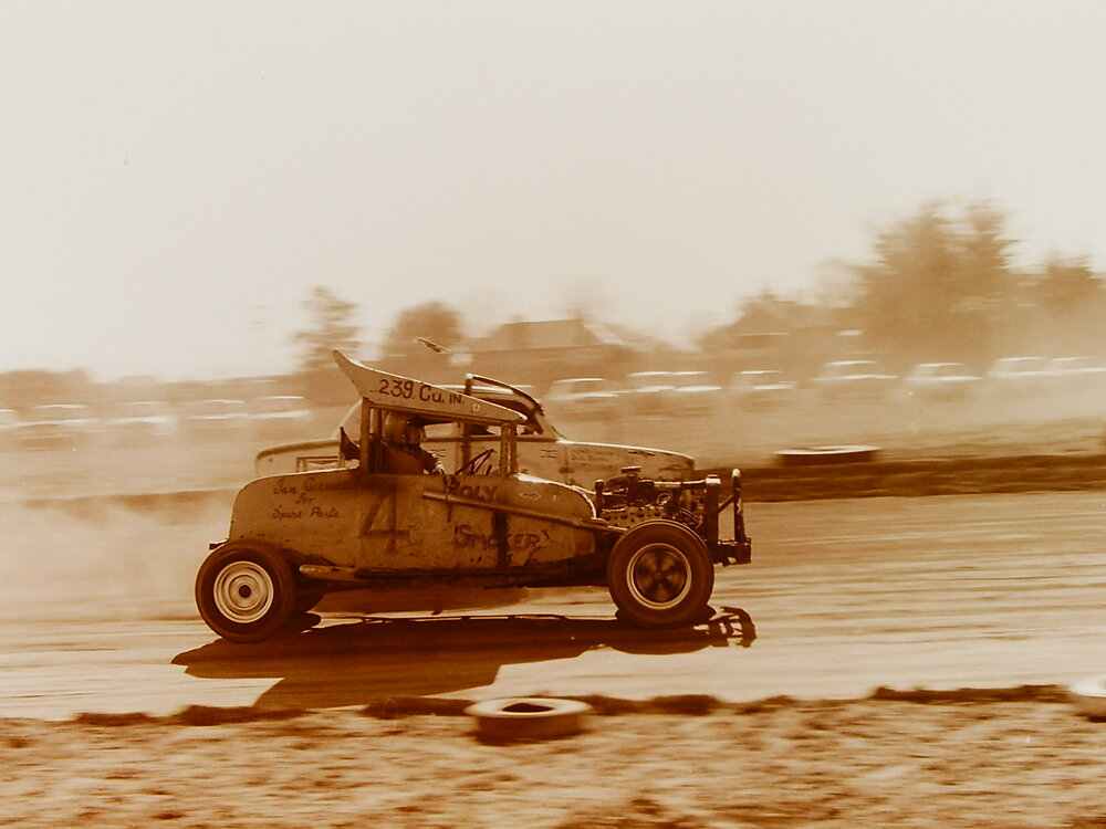 Sprint cars on dirt race track