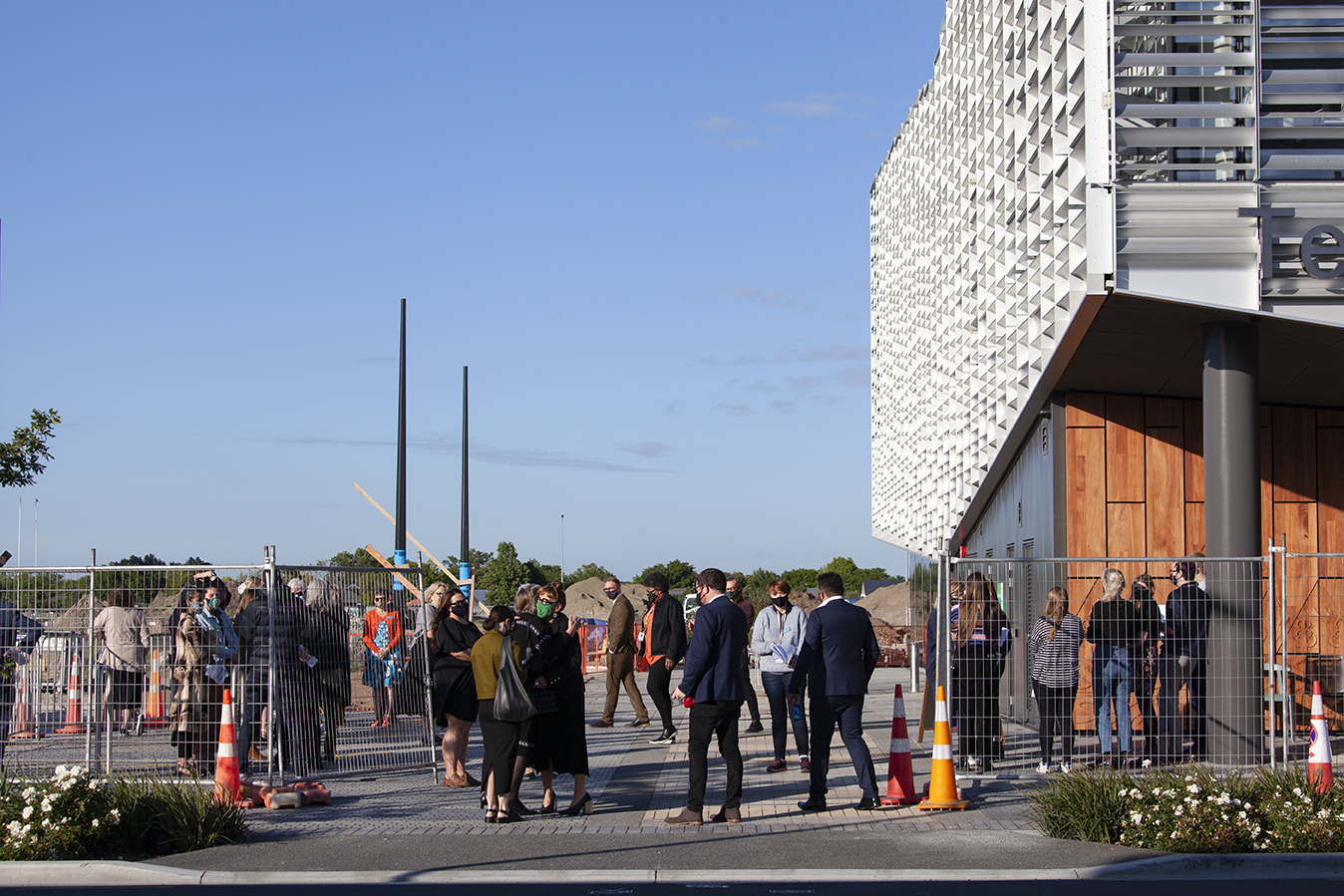 Staff gather outside Te Ara Ātea for the Whakatau whare