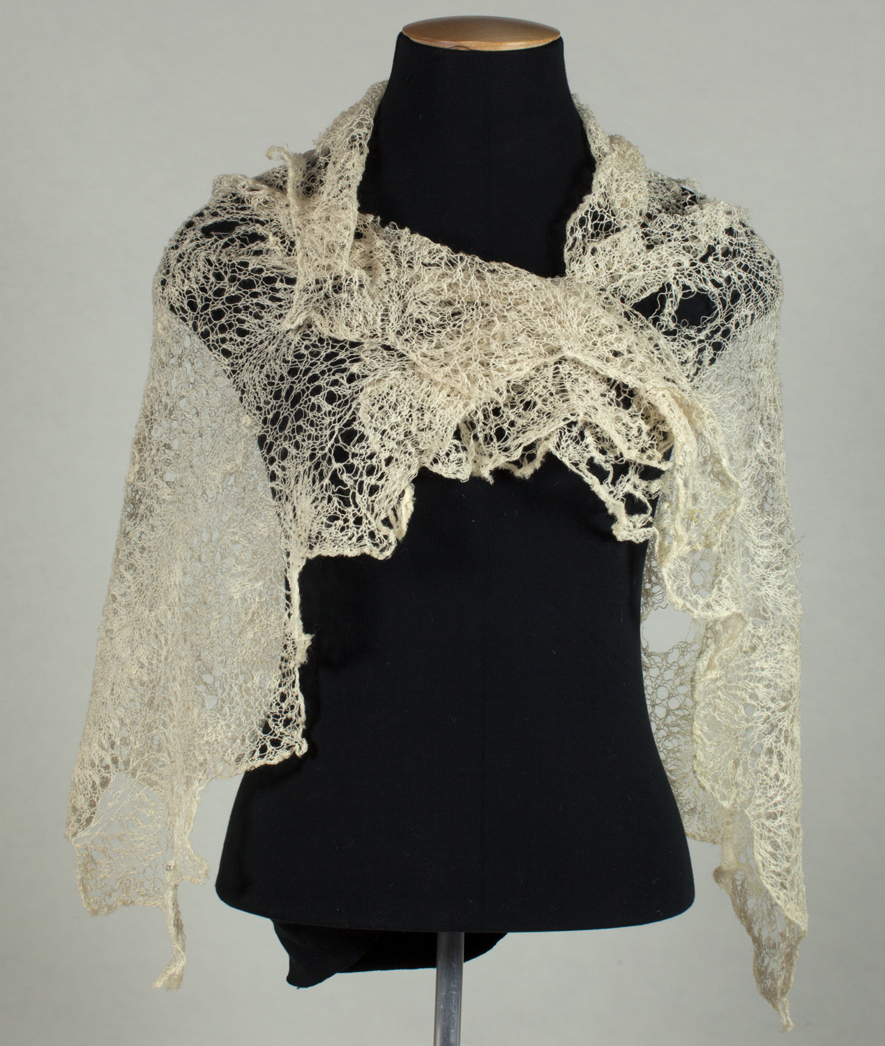 Hand-knitted shawl with scalloped edges made by Caroline McDonald of Leeston