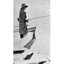Young woman fishing from a dinghy on Waikirikiri Selwyn River, 1925