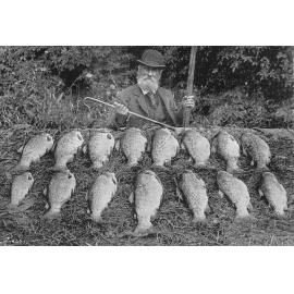Fisherman John Greenslade with several fish, 1900