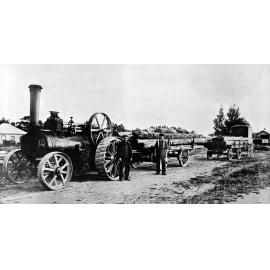 Traction engine loaded with piles leaving Leeston station
