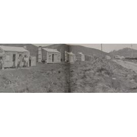 Workmen's huts near the centre shaft, Peak Hill in the distance