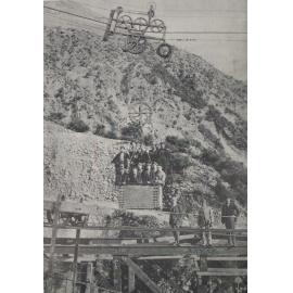 Workmen being taken over the gully in the blondin