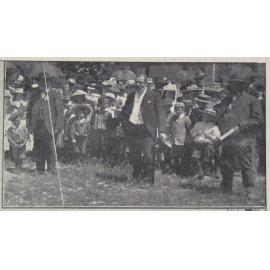 Unfurling the Union Jack flag at Halkett School, G. W. Russell MHR speaking