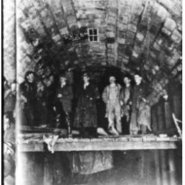 Workers laying the last block of the Ōtira tunnel