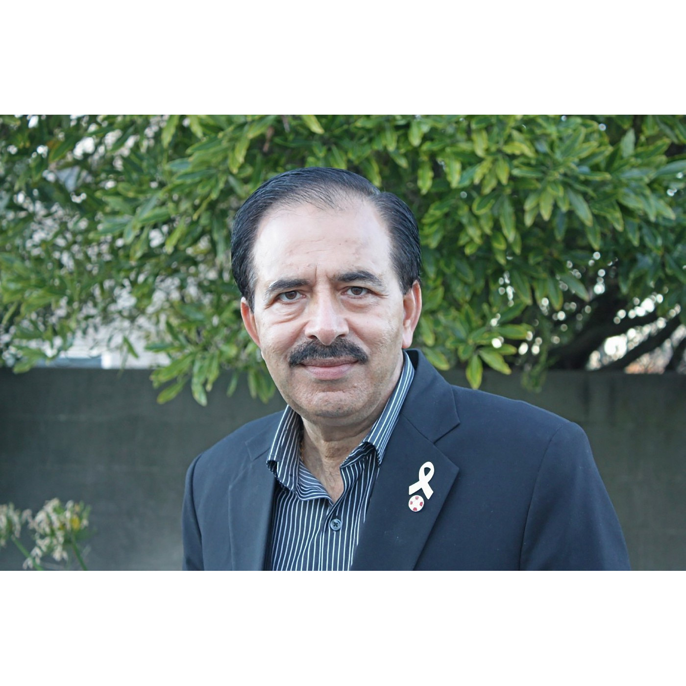 Dr Surinder Tandon