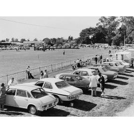 Cars lined up at a show, 1970s