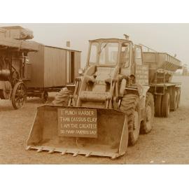 Farm equipment with Cassius Clay sign
