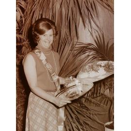 Mrs Springs-Ellesmere 1974 holding flowers