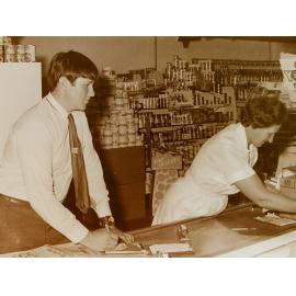 Shop assistants at counter