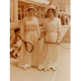 Women in vintage tennis costume