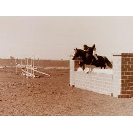 Horse and Rider Jumping at Show Jumping Event