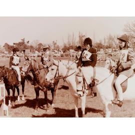 Riders and ponies with ribbons at Pony Club