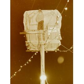 Pole-sitting shelter at night, Leeston Park, 1970