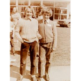 Two boys standing outside church