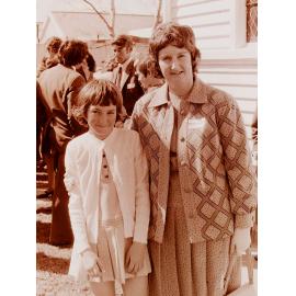 Woman and girl standing outside church
