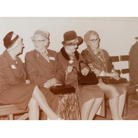 Group of ladies sitting in hall