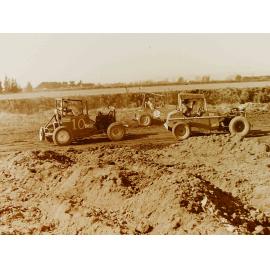 Sprint cars on dirt race track