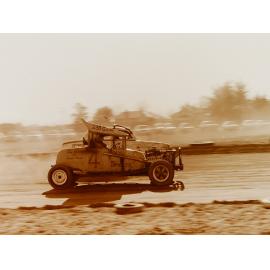 Sprint cars on dirt race track