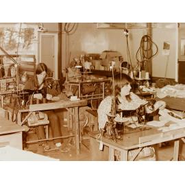 Women at sewing machines in clothing factory
