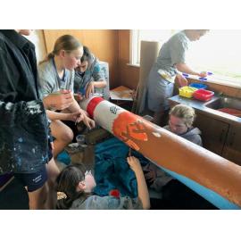 Te Ahi Kaikōmako Rolleston School students painting poles for Te Ara Ātea