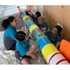 Lemonwood Grove School students painting poles for Te Ara Ātea