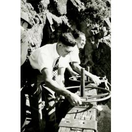 T. W. Tizzard and J. Gillan opening the water race gates