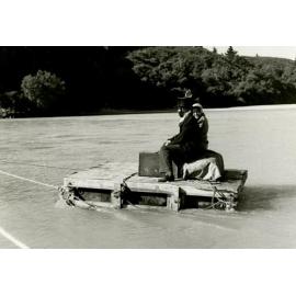 Passengers in costume on a raft in the Waimakariri