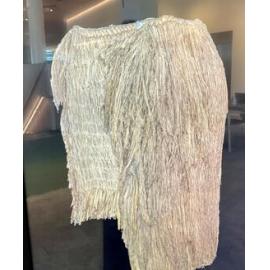 Pākē pātītī, rainproof cape thatched with silver tussock (poa cita).