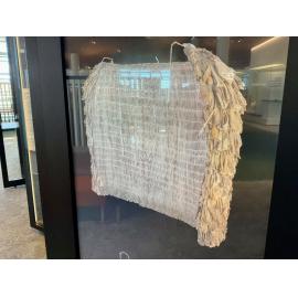 Pākē tikumu, rainproof cape thatched with tikumu leaves, Celmisia sp