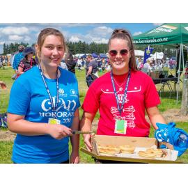 Two women serving Hororāta Pies at the Highland Games