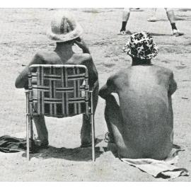 Two spectators watching a volleyball match at Pineglades, c1970s