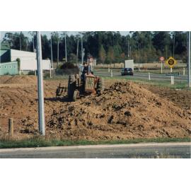 David Foster building mounds on the reserve area on State Highway 1 opposite Rolleston Railway Station