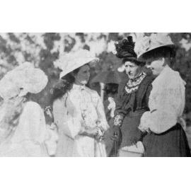 Two women and two girls in conversation at the Courtenay Show, Kirwee