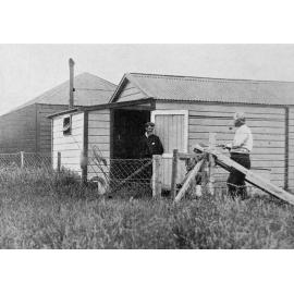 Two men talking, opening of the fishing season, 1909