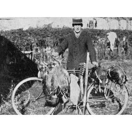 Mr. Fronson Carrying Game on his Bicycle