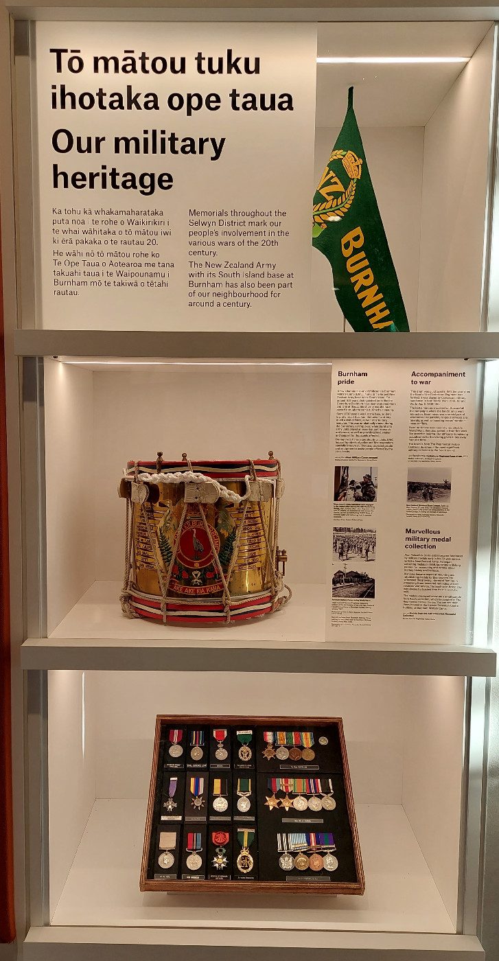 The 2021 heritage exhibition case in Te Ara Ātea containing displays with the theme of Tō mātou tuku ihotaka ope taua: Our military heritage.