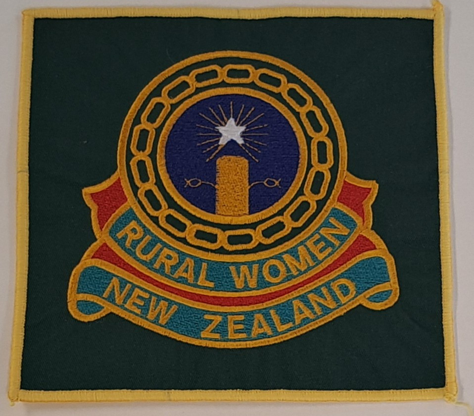 Embroidered badge from the West Melton branch of Rural Women New Zealand, c1999. Courtesy of Mary Watson.