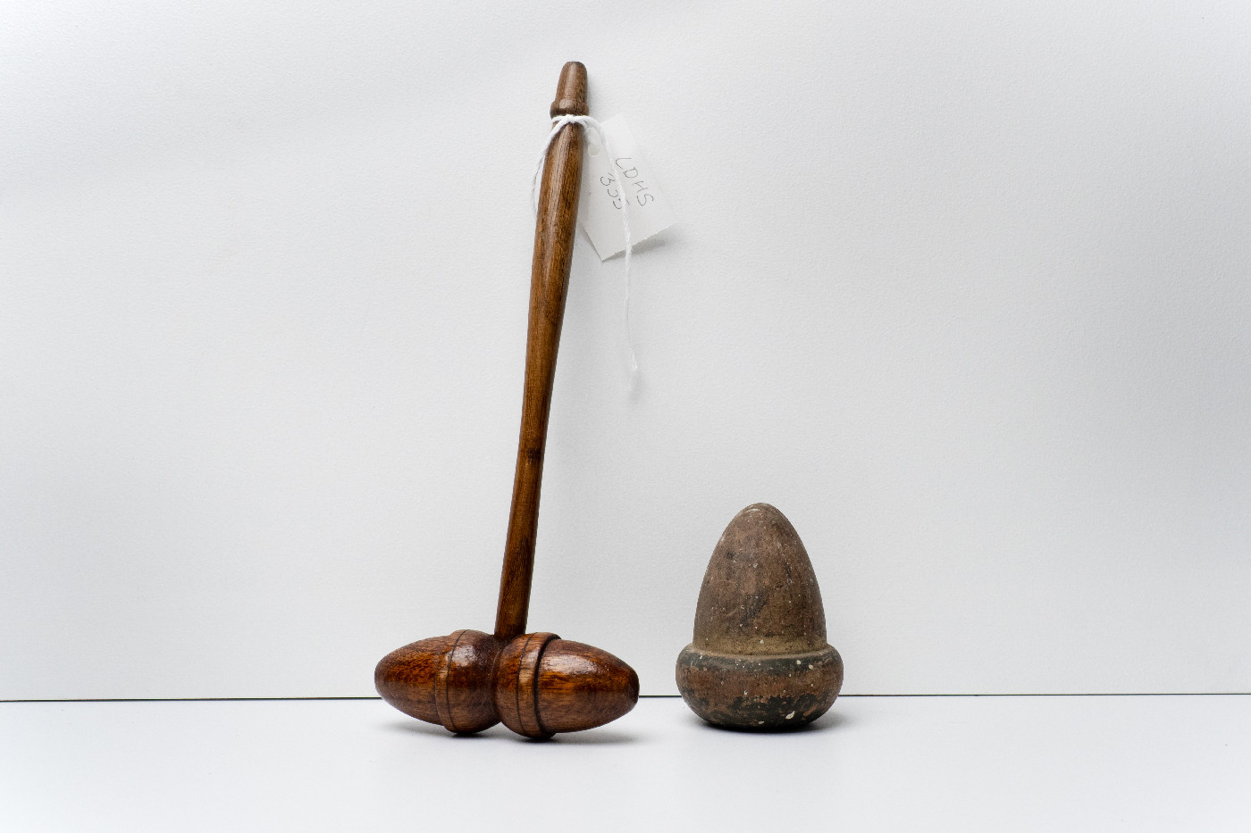 Decorative, wooden, varnished oak gavel, and Wooden Acorn, Ethelbert Lodge, No.4 U.A.O.D, Springston Collection. Lincoln and Districts Historical Society. Photograph by Calum Lyall.